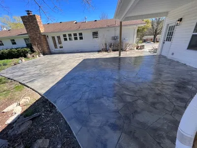 Wide concrete driveway with decorative borders