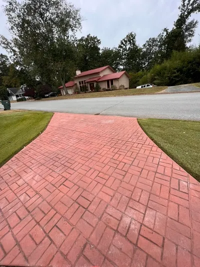 Stamped concrete driveway with brick pattern