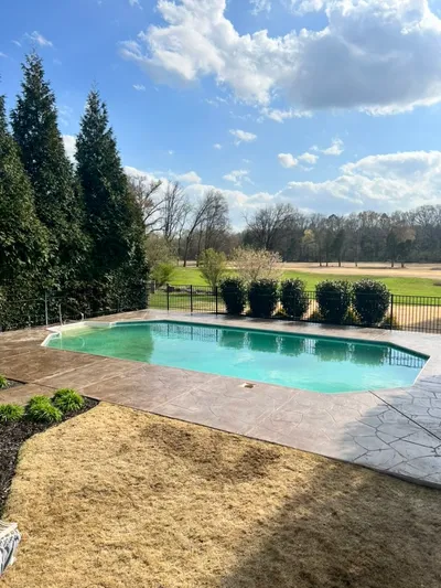 Brown stone-etched pool deck with natural pattern