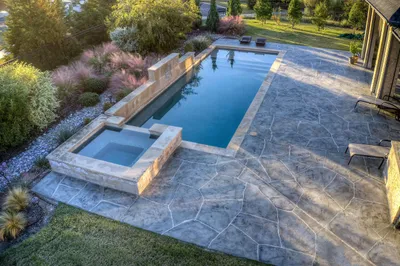 Two-tone gray stone-etched pool deck