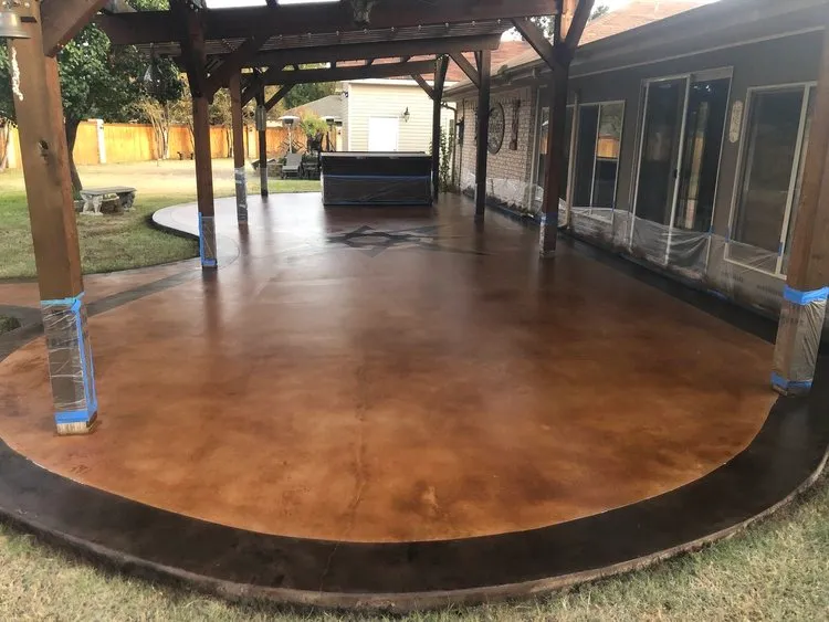 acid stained concrete patio with dark border
