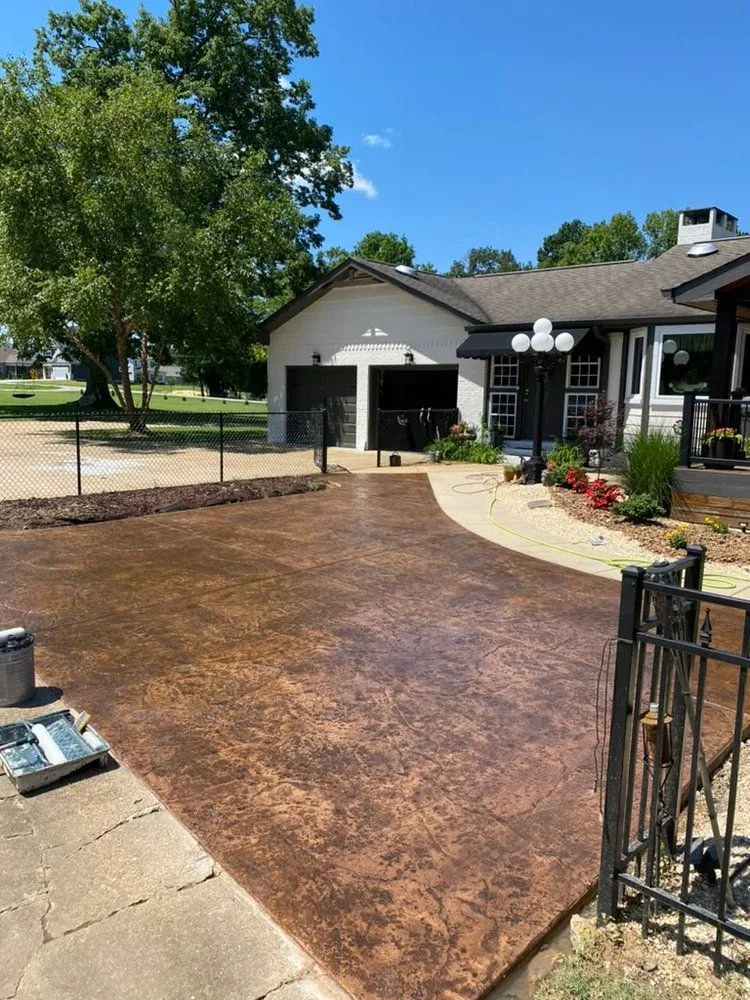 brown stone stamped concrete driveway and walkway